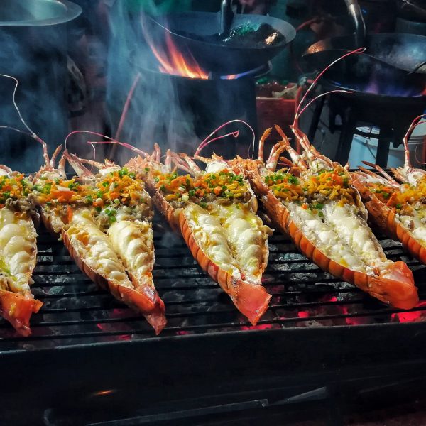 Giant,Grilled,Lobster,Cook,On,Charcoal,Stove,At,Thai,Street